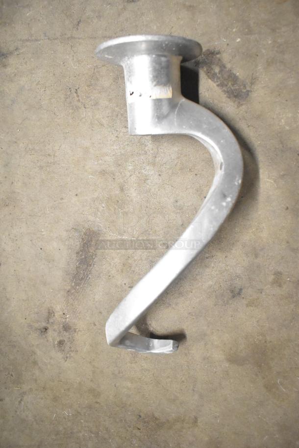 15 mixer attachments for Hobart, includes dough hooks and paddles. Appears in good condition, no visible markings.