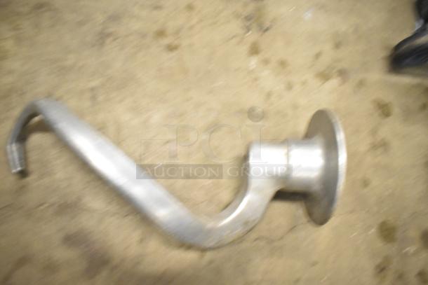 Blurred image of a Hobart mixer dough hook. Condition appears aged. Part of a set of 15 assorted attachments.