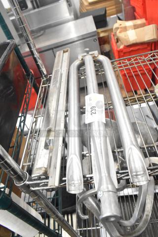 Two metal burner components on wire shelf, good condition, item tag reads "239".