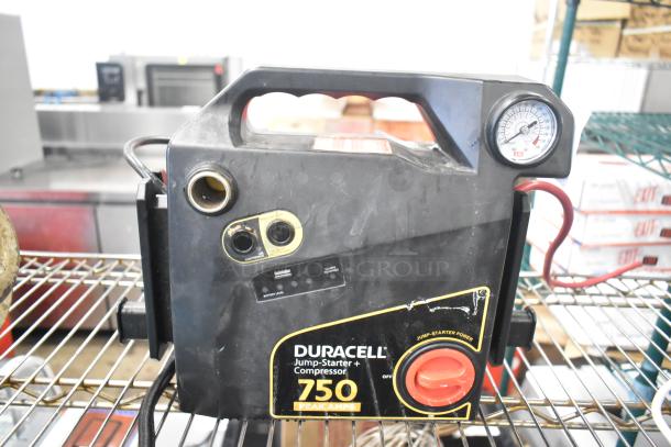 Duracell Jump Starter and Compressor, 750 peak amps, with pressure gauge, well-used, dual charging ports, and safety switch.