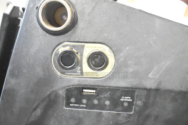 Duracell Jump Starter and Compressor, featuring USB port, battery level indicator, and air compressor button. Visible wear.