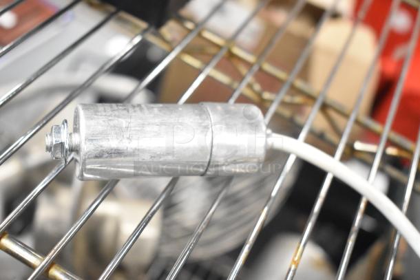 Cubigel NUT70NR Compressor, 115-127V, 1 Phase, in good condition, shown on metal grating.