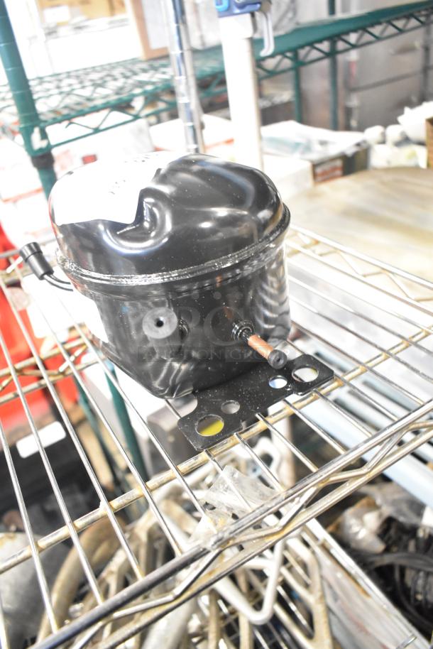 LG TS24LACG Compressor, 115 Volts, 1 Phase, in pristine condition, with visible wiring and connector points.