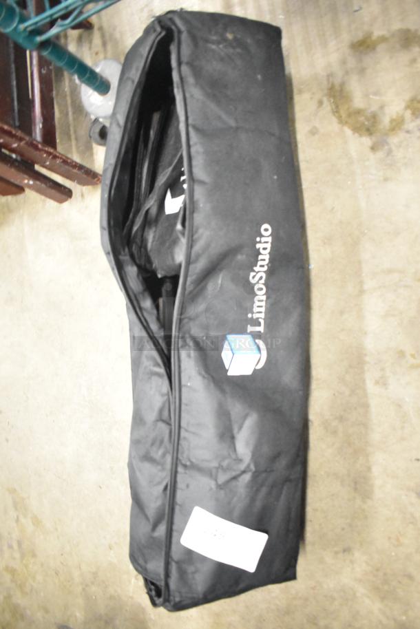 LimoStudio photography setup in a black carrying case, logo visible. Appears gently used, durable storage bag.