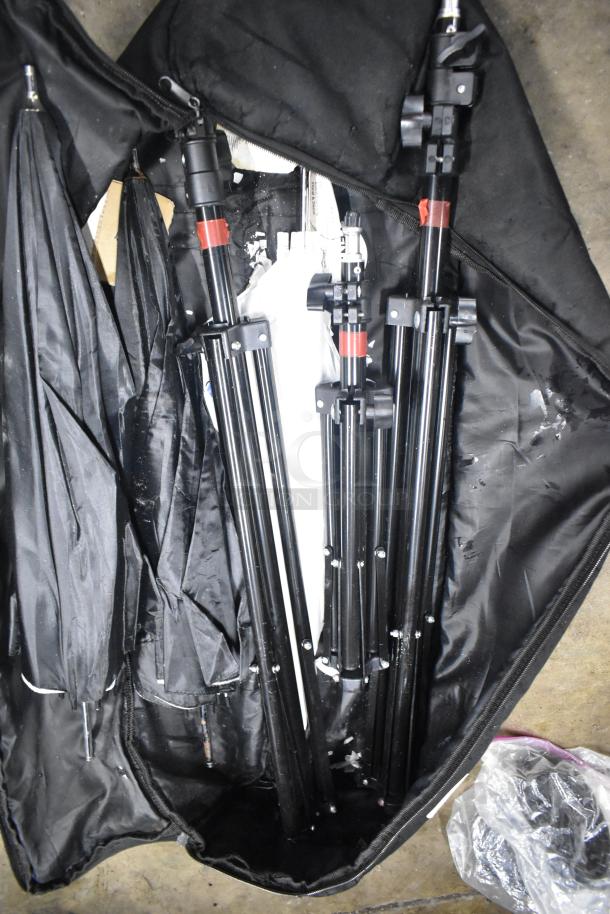 LimoStudio photography setup includes tripods, umbrellas in a black carrying case; equipment appears in good condition.