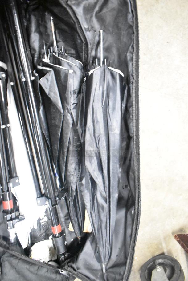 LimoStudio Photography Set Up with black umbrellas and stands in carrying bag, showing signs of use.
