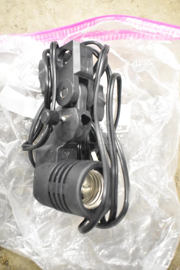 LimoStudio Photography Set Up, featuring black light fixture and cord, appears gently used, stored in clear plastic bag.