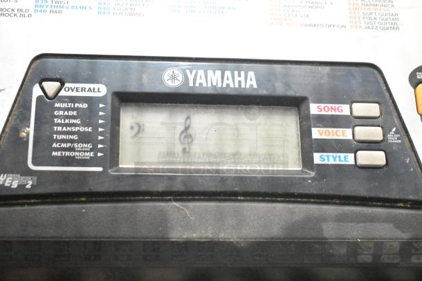 Yamaha PSR-175 keyboard control panel showing buttons for song, voice, and style; includes LCD and function labels.