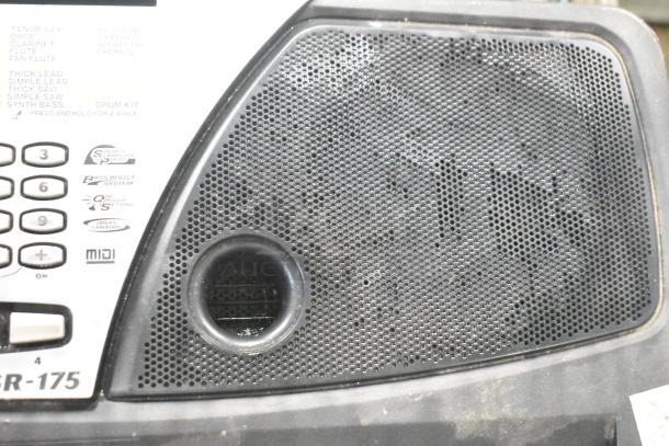 Yamaha PSR-175 Keyboard, textured speaker grille, visible buttons, Bass Boost System, MIDI capability, slight wear.