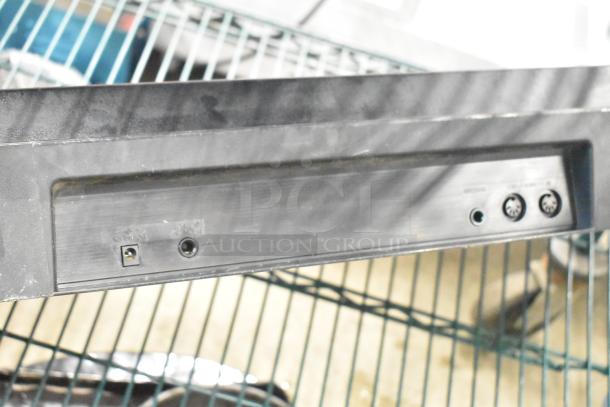 Rear view of a Yamaha PSR-175 Keyboard showing power input, headphone jack, and MIDI ports. Appears in used condition.