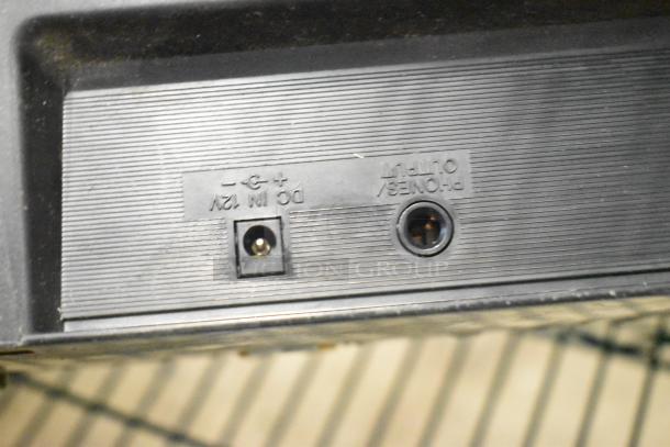 Yamaha PSR-175 Keyboard back panel showing DC IN 12V and headphones/output jacks, part of its connectivity features.