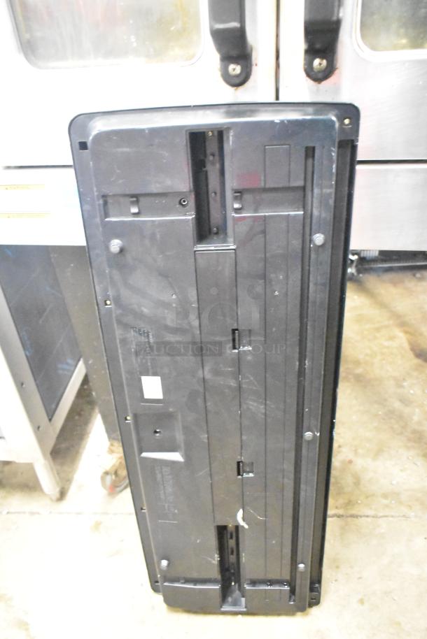 Back view of a Yamaha PSR-175 keyboard showing its casing and mounting slots. Visible wear and minor scratches.