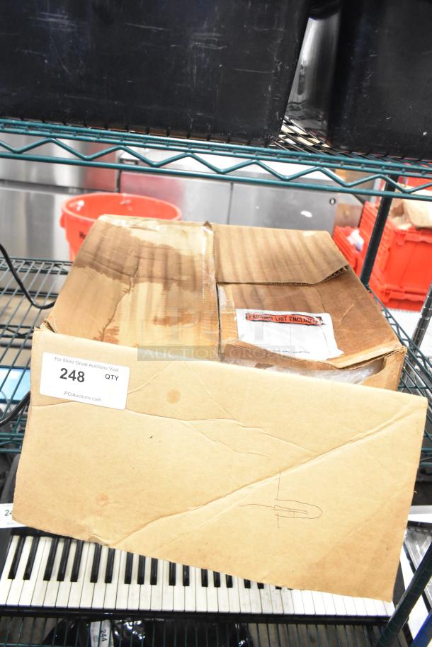 Cardboard box containing Mr Induction SR-650M Single Burner Induction Range on a shelf. Box showing wear with visible label and auction tag.
