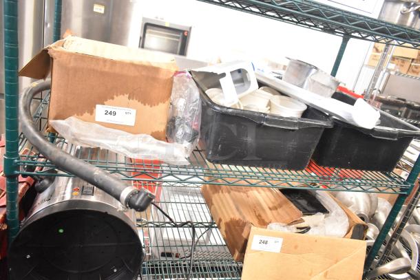 Various items on metal shelves, including white ceramic ramekins in black poly bus bins, cardboard boxes labeled "249" and "248," containing assorted items.
