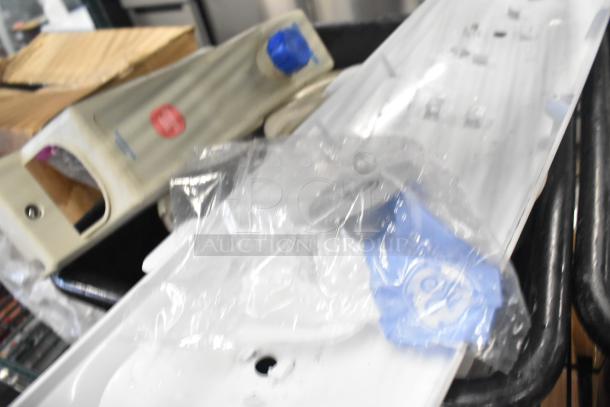 Various items including a white ceramic ramekin, black poly bus bins, and miscellaneous items, mixed condition.