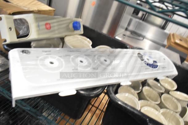 Tier lot featuring white ceramic ramekins, black poly bus bins, and various kitchen items. Mixed condition.