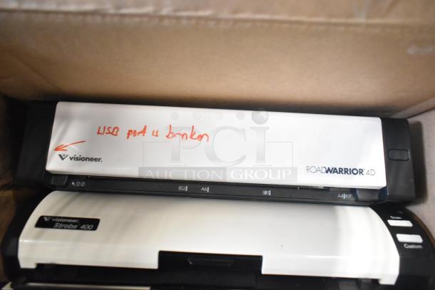 Cardboard box with Visioneer RoadWarrior 4D scanner labeled "USB port is broken," and Visioneer Strobe 400 scanner.