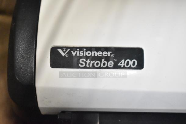 Visioneer Strobe 400 scanner, white with black trim. Label shows model and brand. Condition appears good, slight wear.