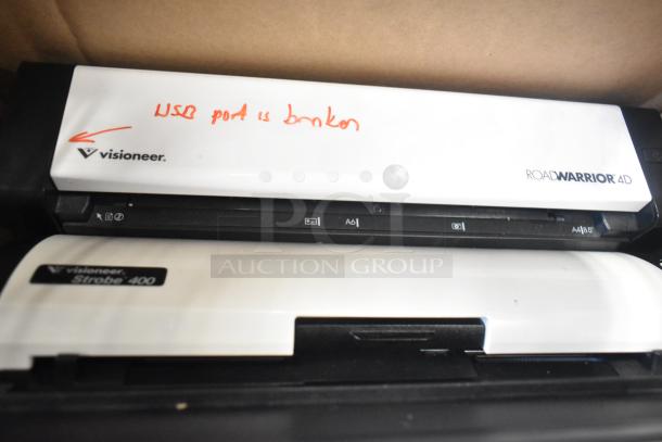 Various items including Visioneer RoadWarrior 4D and Strobe 400 scanners, USB port labeled "broken."