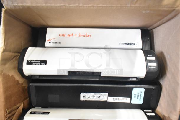 Box containing Visioneer scanners, including Strobe 400 and RoadWarrior 4D models, with a note indicating USB port issues.