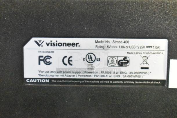 Label on Visioneer Strobe 400 device showing model info, power rating, and compliance certifications.