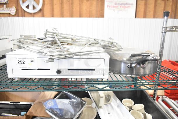 Eight-item lot with cash drawer, two saucepans, and chrome brackets. Visible tag: Auction Quantity 8, Lot 252.