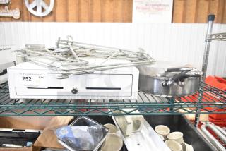 Eight-item lot with cash drawer, two saucepans, and chrome brackets. Visible tag: Auction Quantity 8, Lot 252.