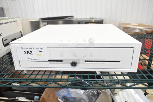 White cash drawer on shelf, includes key slot and auction label "252 QTY x8." Part of lot with saucepans and brackets.