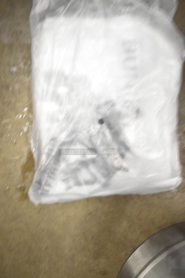 Bunn Countertop Beverage Holder Dispenser, wrapped in plastic, unclear condition.