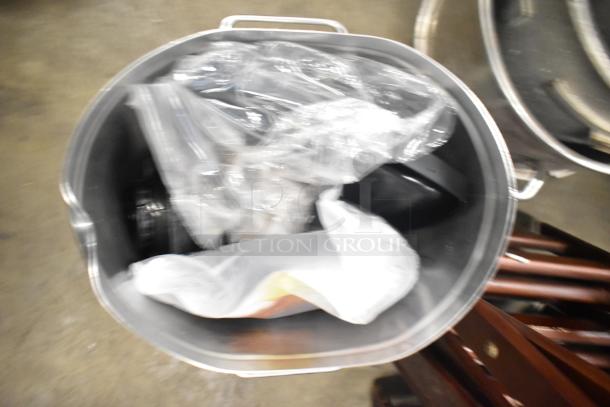 Bunn Countertop Beverage Holder Dispenser in stainless steel, includes plastic-wrapped parts; appears in used condition.