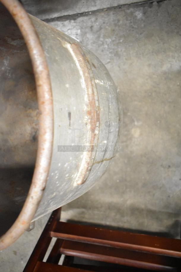 Five various metal mixing bowls with visible wear and patina, indicating vintage or frequent use. Ideal for collectors.