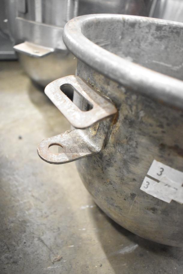 Set of five metal mixing bowls, varying sizes, robust condition, surface wear, visible numeric label "3" on bowl.