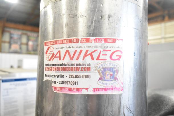 Ball Lock Keg with visible Sanikeg label from Keystone Homebrew Supply, indicating trade and sanitization program. Good condition.