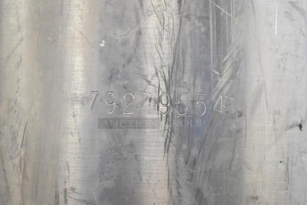 Ball Lock Keg with engraved number 79249554. Stainless steel surface shows moderate wear, indicating prior use.