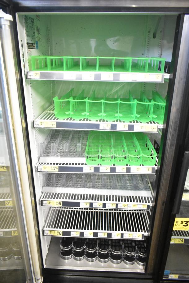 True GDM-49 Commercial 2 Door Cooler Merchandiser, 115V, 1 Phase, clean shelves, visible pricing labels, excellent condition.