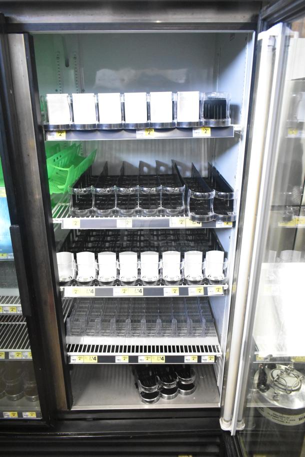 True GDM-49 Commercial 2 Door Cooler Merchandiser, 115V, features adjustable shelves, glass doors, and price labels.