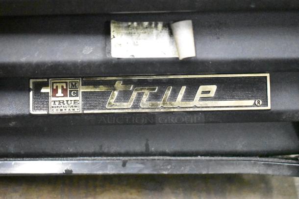 True GDM-49 Commercial Cooler nameplate with True Manufacturing Company logo.