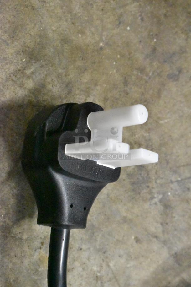 Close-up of a black electrical plug for the Gaggia MGV293NPU espresso machine, 220/230 Volts.