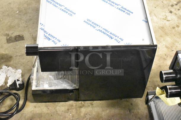 Brand new Gaggia MGV293NPU Vetro black 3 group automatic espresso machine, 220/230 volts, slight scratches and dents.