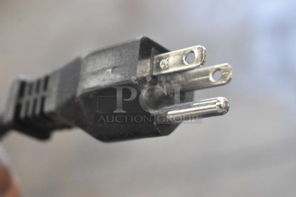 Close-up of a three-prong plug from a Hobart FP-150 food processor. Standard 110-120V, 1 phase.