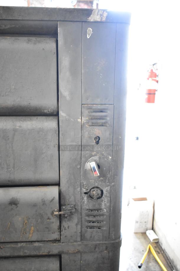 Blodgett commercial gas-powered dual-deck pizza oven, showing side view with dials and hinges, in used condition.
