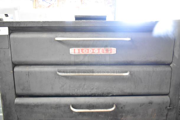 Blodgett commercial gas-powered 2 deck pizza oven, black exterior, three handles, Blodgett logo visible.