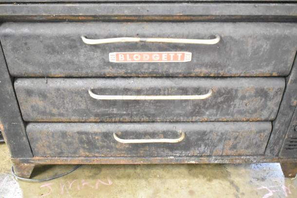 Blodgett commercial gas pizza oven with two decks. Features worn, black exterior and visible Blodgett branding.