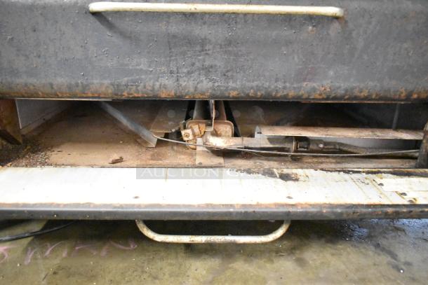 Blodgett commercial gas-powered 2-deck pizza oven, showing signs of use and wear, with visible interior components.