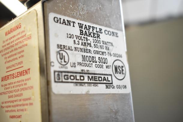 Gold Medal 5020 countertop waffle cone maker, 120 volts, 1000 watts, stainless steel, label shows product specifications and warnings.
