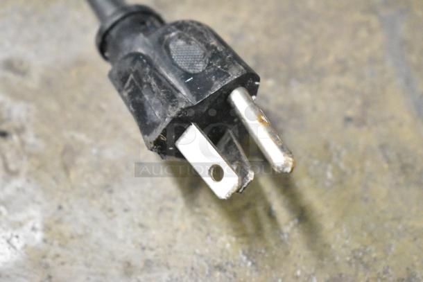 Close-up of a power plug for the IDW G-12-F334B-HC cooler, showing a standard 115V, 1 phase connection.