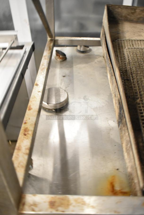 Rational CMP62G CombiMaster Plus convection oven with equipment stand. Visible signs of rust and wear on the metal stand.