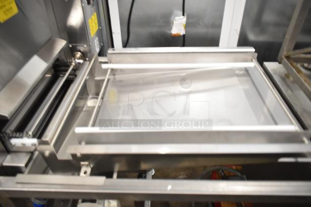 Brand new 2025 Belshaw Adamatic TG-50 stainless steel thermoglazing station on casters with visible labels. 208V, 1 phase.