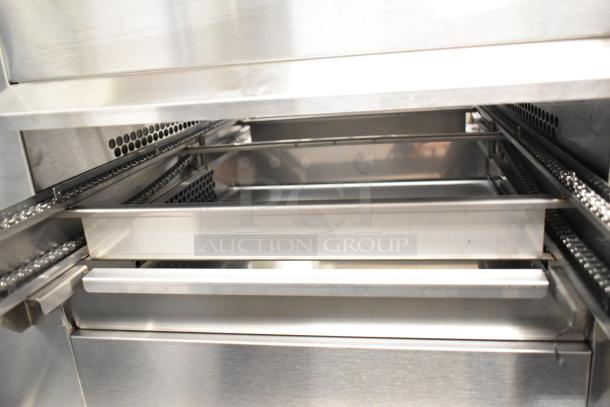 Brand new Belshaw Adamatic TG-50 stainless steel thermoglazing station, visible internal tray and chain mechanism.