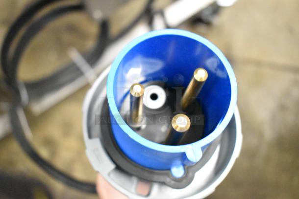 Close-up of a blue connector, part of the Belshaw Adamatic TG-50 Thermoglazing Station. New with minor scratches.